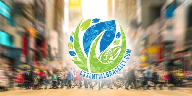 Essential oils on-the-go Essential Bracelet logo with people crossing street in the background